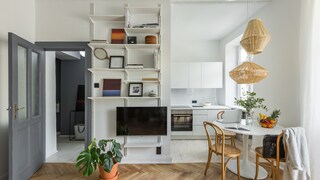 A small round table and chairs serve as a mini dining area in the kitchen.