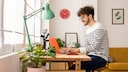 Young student sitting at his desk