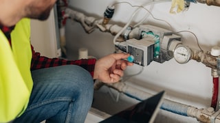 Technician Works on Heating System