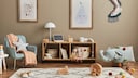 Neutral colors, animal motifs, and modular furniture are part of the design for a children's room in 2024.
