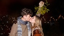 Some people kiss under a mistletoe at Christmas. But what is the story behind this tradition?