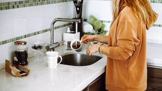 If a small amount of coffee grounds goes down the drain while washing dishes, it's generally not a cause for concern.