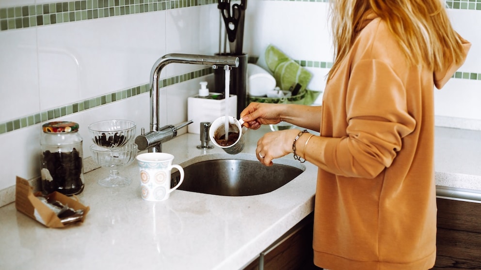 If a small amount of coffee grounds goes down the drain while washing dishes, it's generally not a cause for concern.