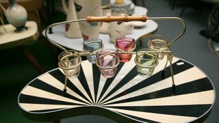 Kidney-Shaped Table in Bold Pattern Serves as Practical Storage