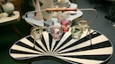 Kidney-Shaped Table in Bold Pattern Serves as Practical Storage