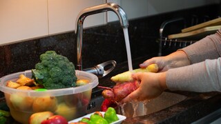 Someone grows fruit and vegetables under running water