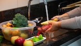 Someone grows fruit and vegetables under running water