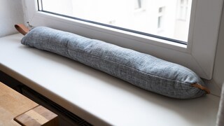 A draft stopper is a temporary solution for drafty windows and doors.