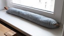 A draft stopper is a temporary solution for drafty windows and doors.