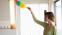 Woman Cleaning with a Feather Duster