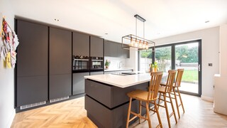 A black kitchen with a white countertop can create more contrast.