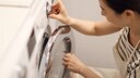 Many washing machines have a well-hidden switch that can stop the machine in an emergency.