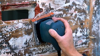 If there are multiple layers of paint on the door, you should use sandpaper gradually.