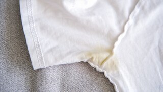 Unsightly deodorant stains are no reason to toss your T-shirt—simple home remedies can help.
