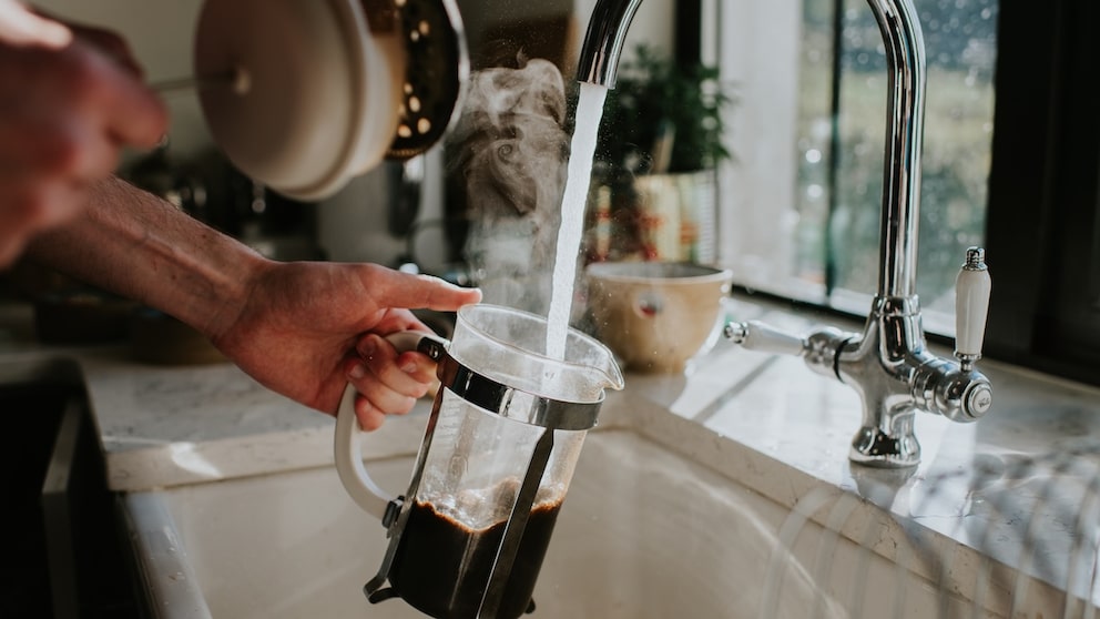 If a small amount of coffee grounds goes down the drain while washing dishes, it's generally not a cause for concern.