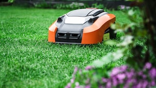 Does a robotic lawn mower consume a lot of electricity when in standby mode?