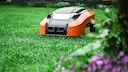 Does a robotic lawn mower consume a lot of electricity when in standby mode?