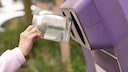 Is it necessary to remove the lids from glass recyclables before disposing of them?