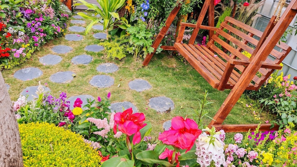 The childhood garden had many flowers and a porch swing where Grandma sometimes slept. (Stock photo)