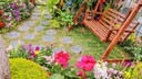 The childhood garden had many flowers and a porch swing where Grandma sometimes slept. (Stock photo)