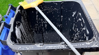 Do users have to clean the trash bin themselves if it gets dirty?