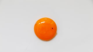 Can an egg with a spot on it still be eaten, or should it be discarded?