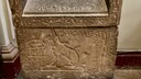 A sarcophagus from Egypt features a relief of a cat.