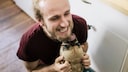 Why do dogs almost immediately like some people, and how do they show it?