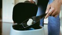 Woman Throws Clumped Cat Litter in Trash Can