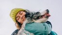 Woman Hugs Her Dog