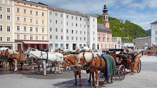 Horse-drawn carriages at Residenzplatz in Salzburg's Old Town