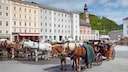 Horse-drawn carriages at Residenzplatz in Salzburg's Old Town
