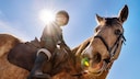 Child Sits on Horseback