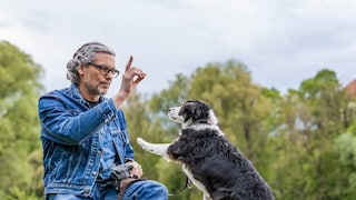 A man trains his dog