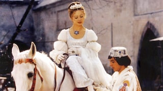 Scene from Three Hazelnuts for Cinderella, when Cinderella sits on the horse and the prince slips the shoe onto her foot