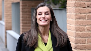 Queen Letizia smiles directly at the camera, very sweetly.