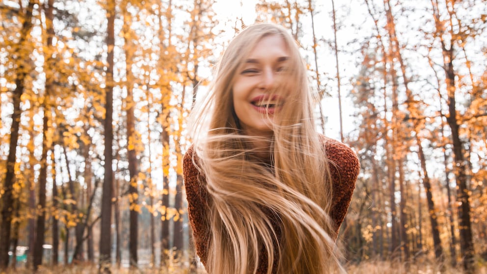 Woman with long blonde hair, who must be taking biotin