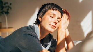 Woman lying in the sun, she looks relaxed, as if her hormones are in balance
