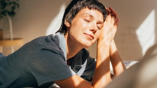 Woman lying in the sun, she looks relaxed, as if her hormones are in balance