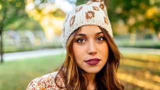 Woman with plum lipstick in the park