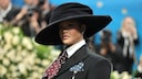 Rihanna loves extravagant accessories, whether it's giant hats or an oversized baguette bag.