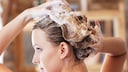Woman Washes Her Hair With Shampoo