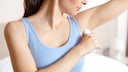 Woman Holding a Deodorant Stick