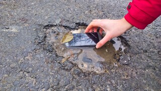 Smartphone in a Puddle