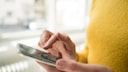 Woman with smartphone in hand