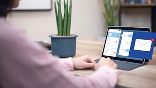Woman Writing Email on Laptop