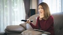 Woman Watching TV: Sat.1 Weekend Programming