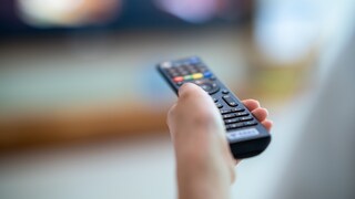 Remote Control in Front of TV Set