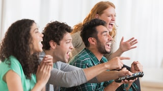Sky Sport and Showcase: A Cheerful Group of Friends in Front of the TV