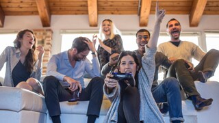 Group of Friends Plays with Console